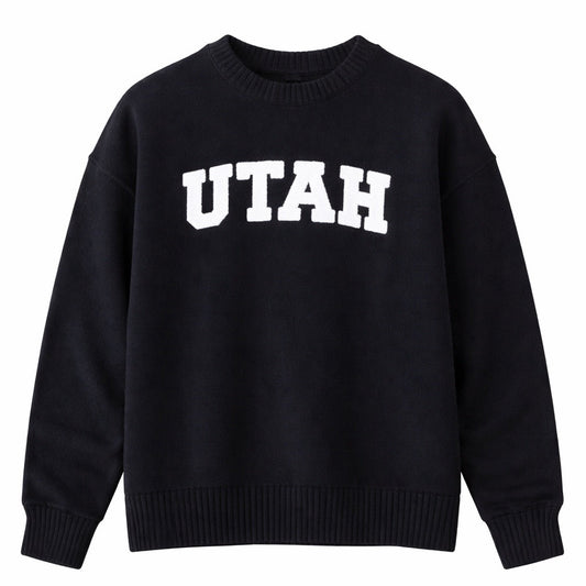 Black sweater with 'UTAH' printed on it against a white background