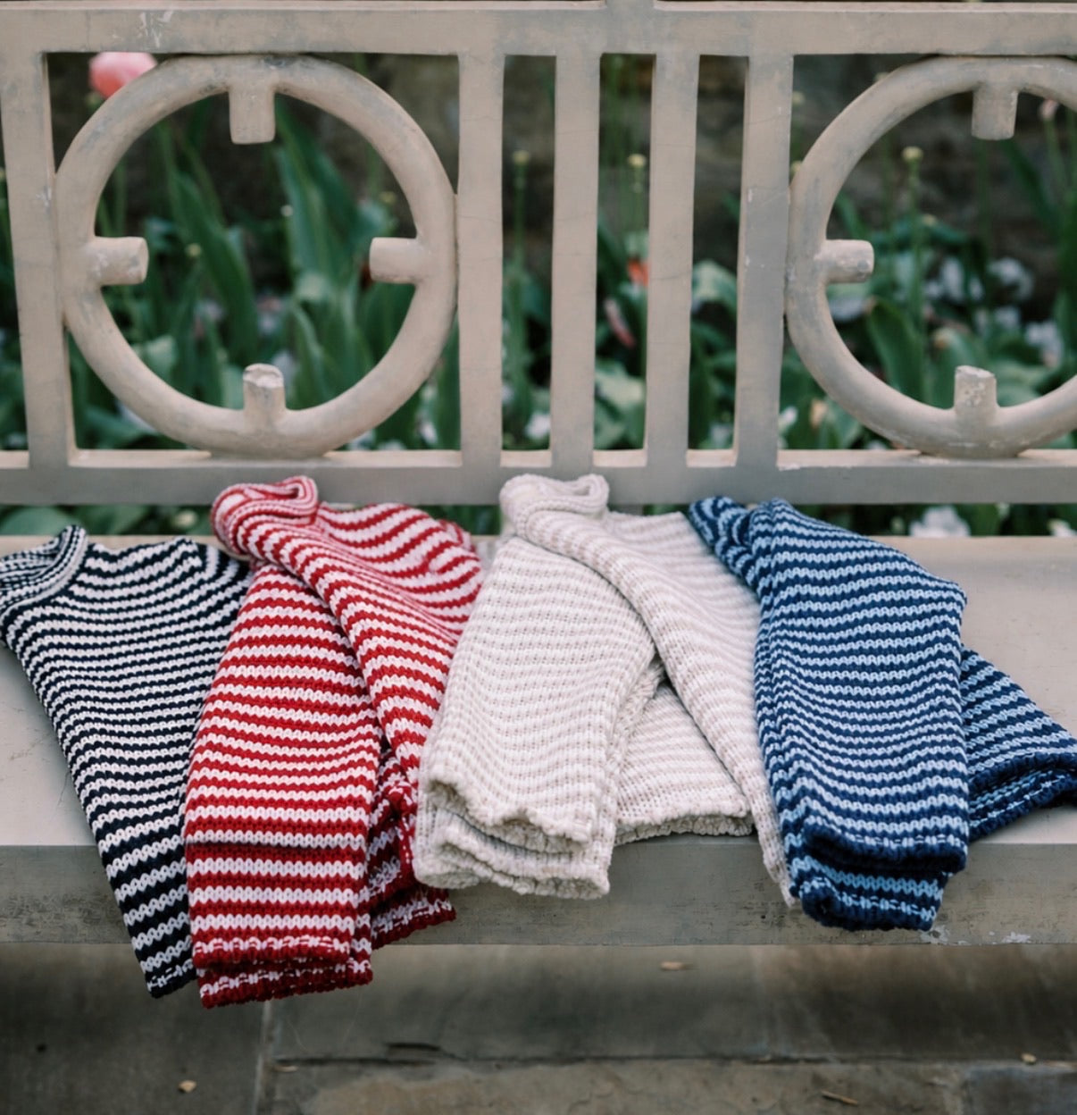 Sweaters on a bench