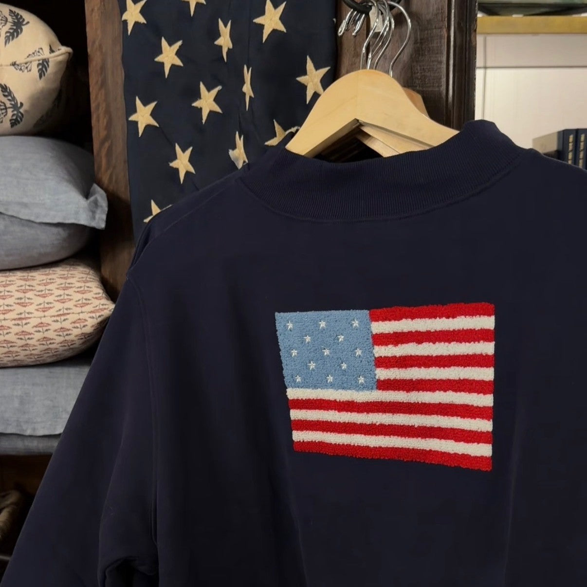 American flag sweatshirt hanging up