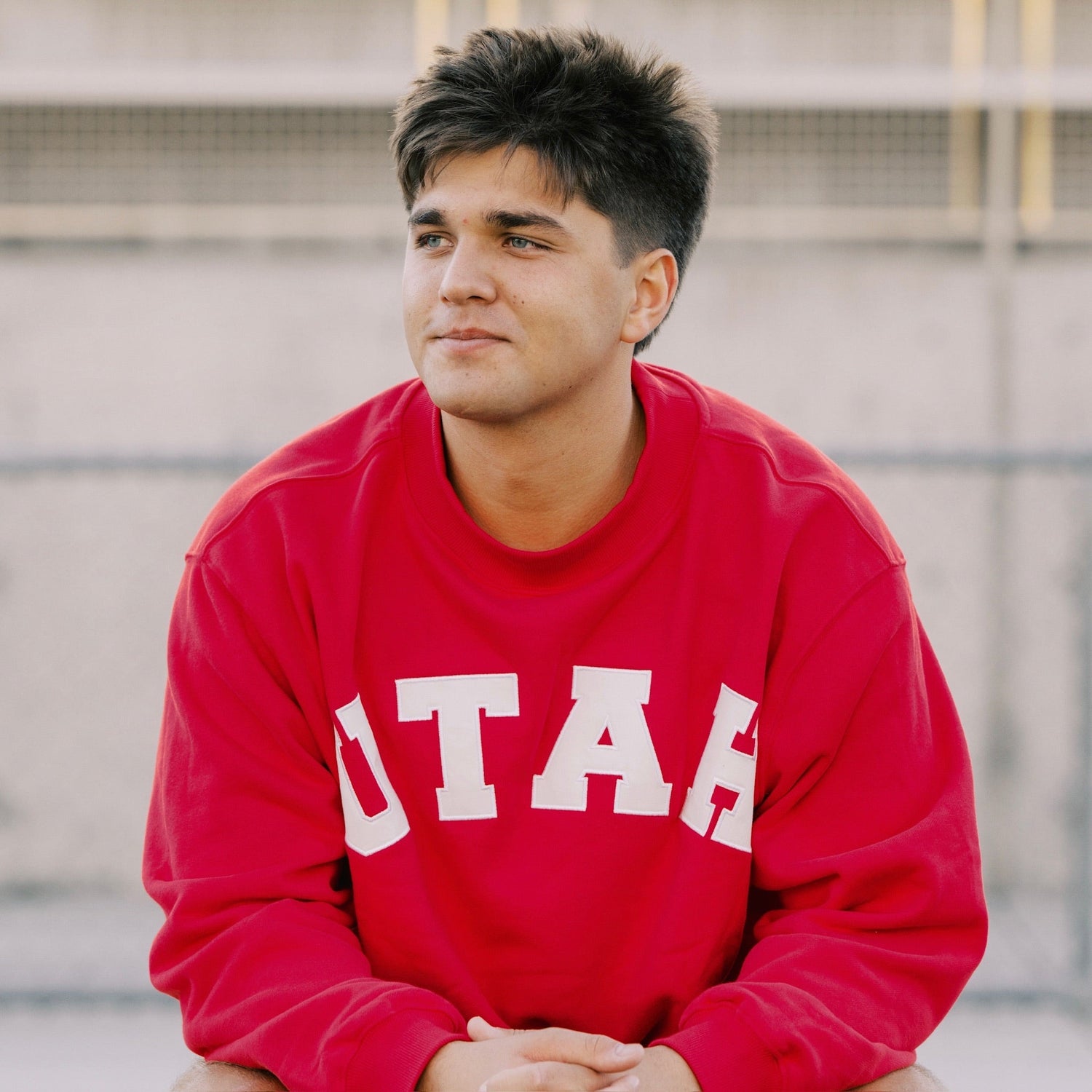 Man in Utah sweater smiling