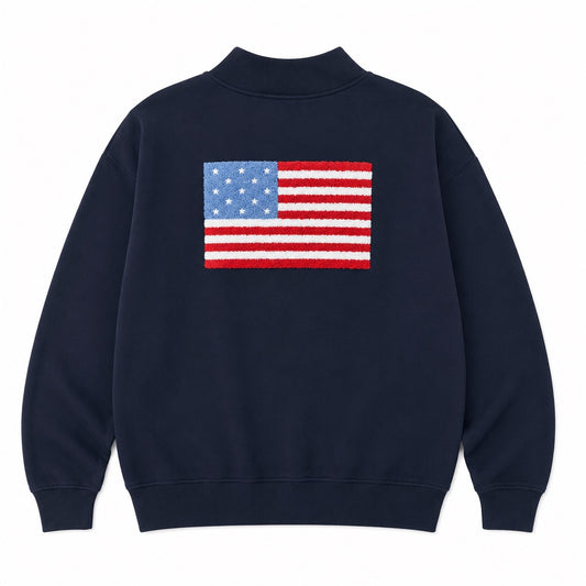Navy blue sweatshirt with American flag on the back against a white background