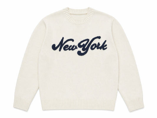 White sweater with 'New York' text on a white background