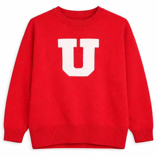 Red sweater with a white 'U' on a white background