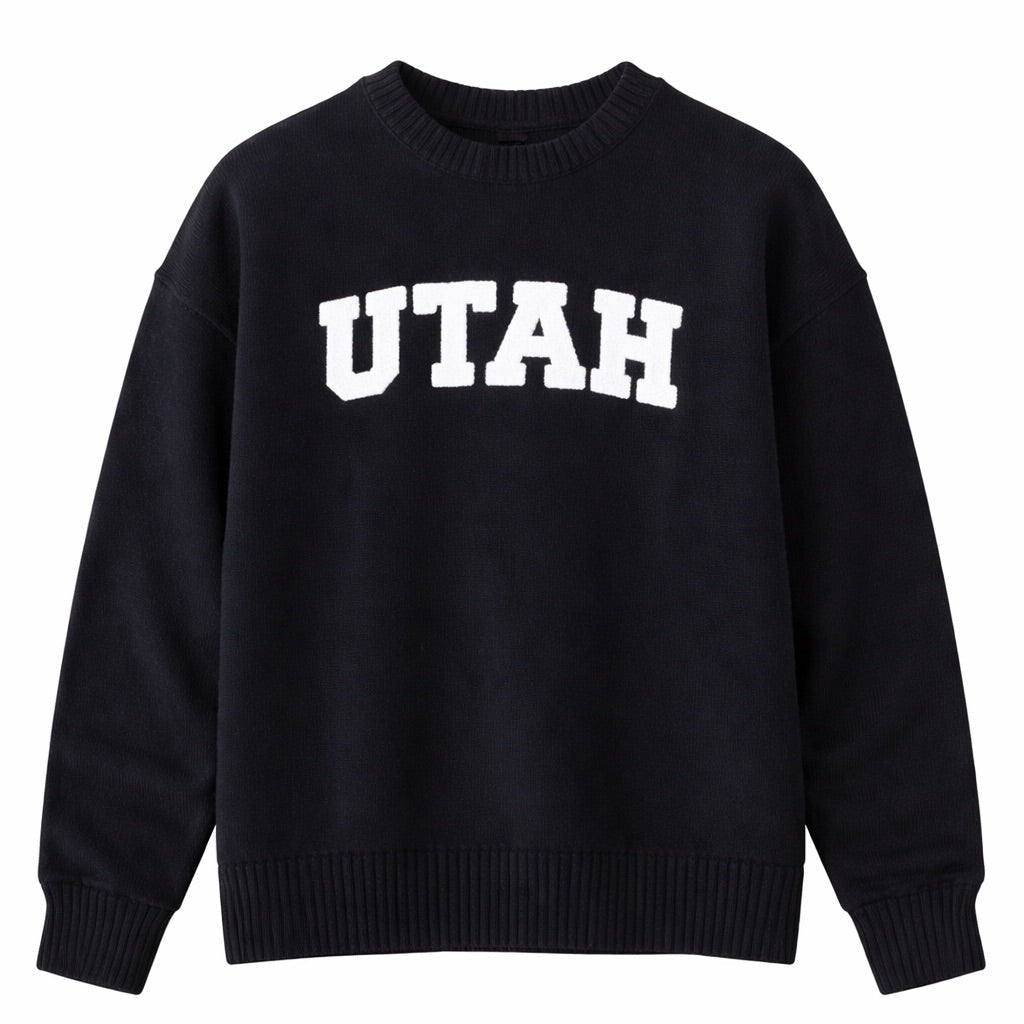 Black sweater with 'UTAH' printed on it against a white background